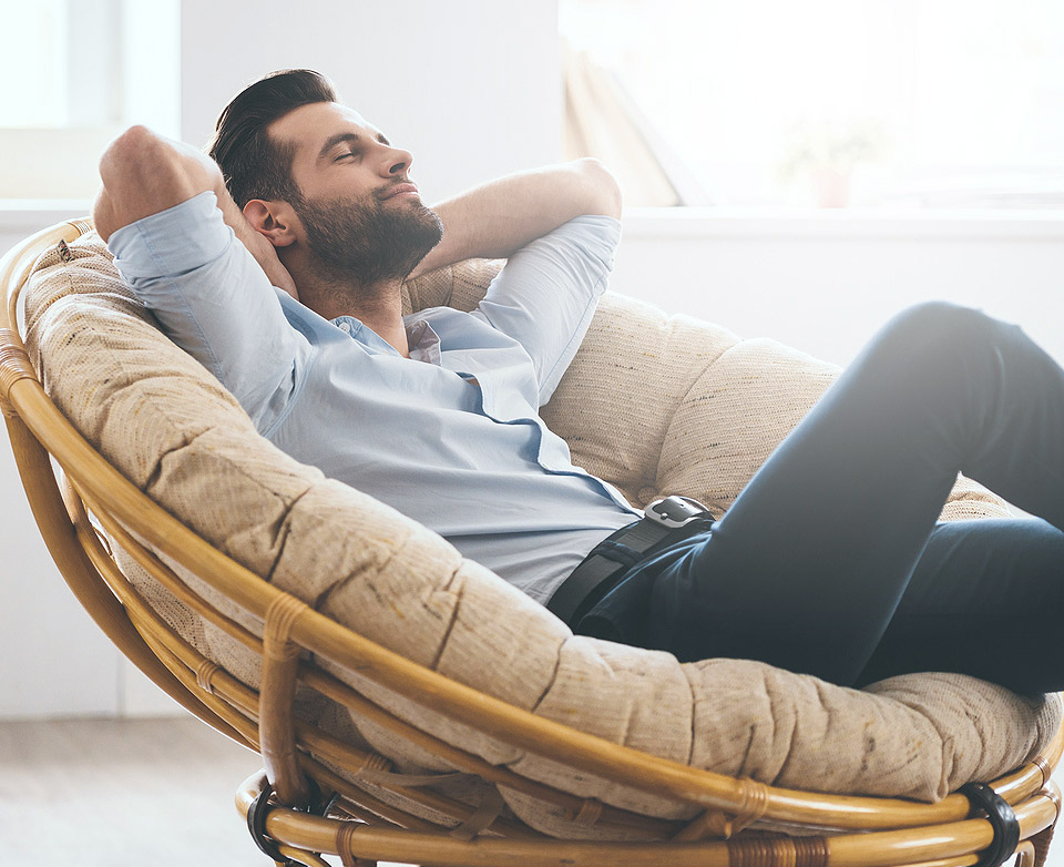 man relaxed in air conditioned home
